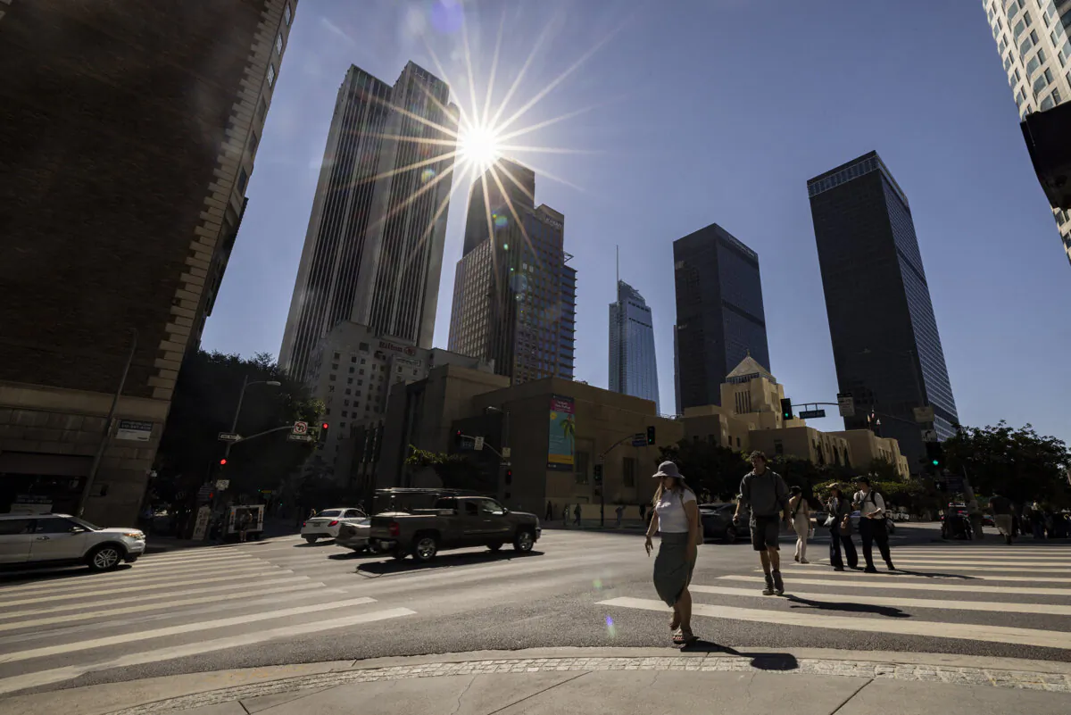 Pedestrians cross a street in downtown Los Angeles on Sept. 4, 2024. (Etienne Laurent/AFP via Getty Images)