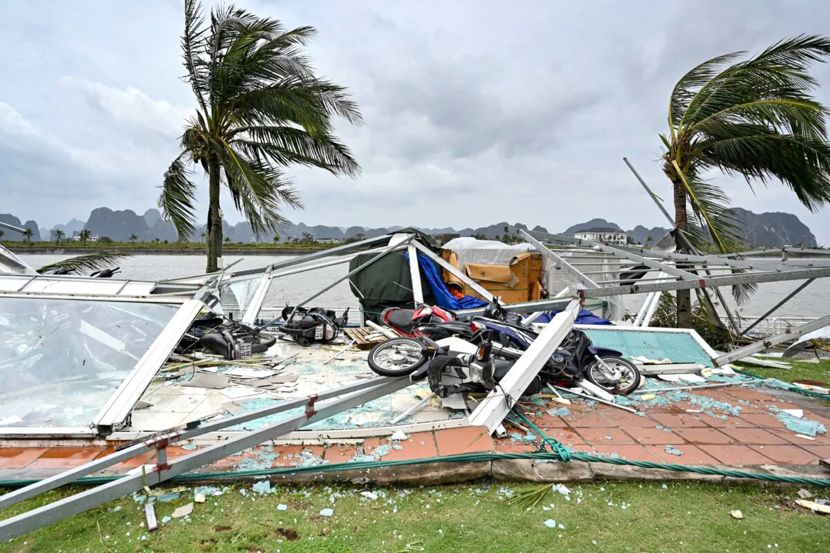Swept motorbikes with the debris of destroyed waiting lounges on the shore after Super Typhoon Yagi hit Ha Long bay, in Quang Ninh province, Vietnam, on Sept. 8, 2024. (Nhac Nguyen/AFP via Getty Images)