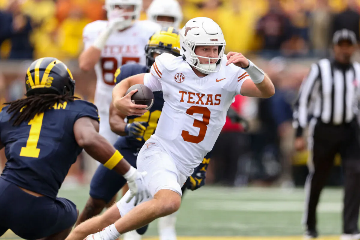 Quinn Ewers #3 of the Texas Longhorns rushes during the first quarter against the Michigan Wolverines at Michigan Stadium on September 07, 2024 in Ann Arbor, Michigan. (Gregory Shamus/Getty Images)
