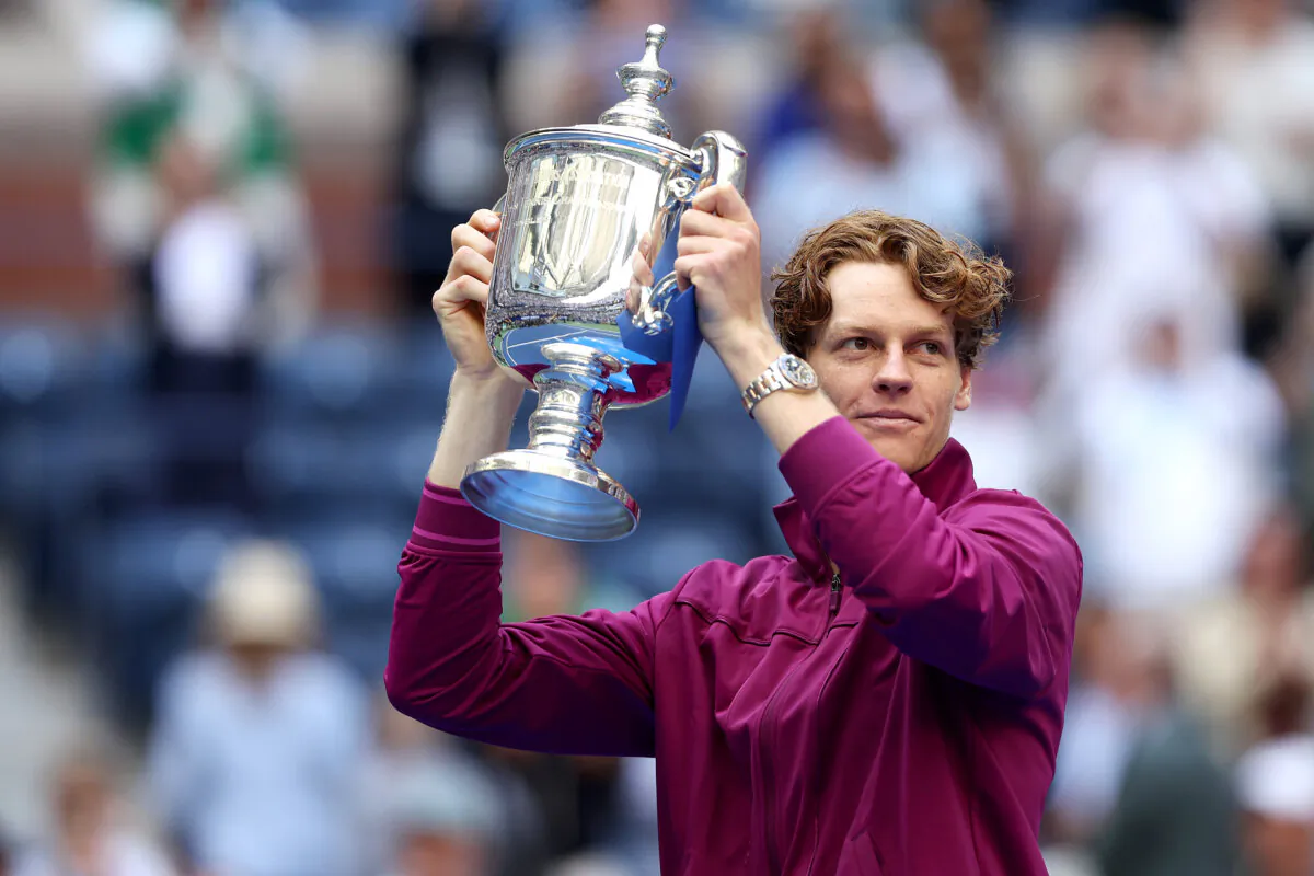 Jannik Sinner of Italy celebrates with the winners trophy after defeating Taylor Fritz of the United States to win the men's singles final of the 2024 U.S. Open at USTA Billie Jean King National Tennis Center in the Flushing neighborhood of the Queens borough of New York City on Sept. 8, 2024. (Matthew Stockman/Getty Images)