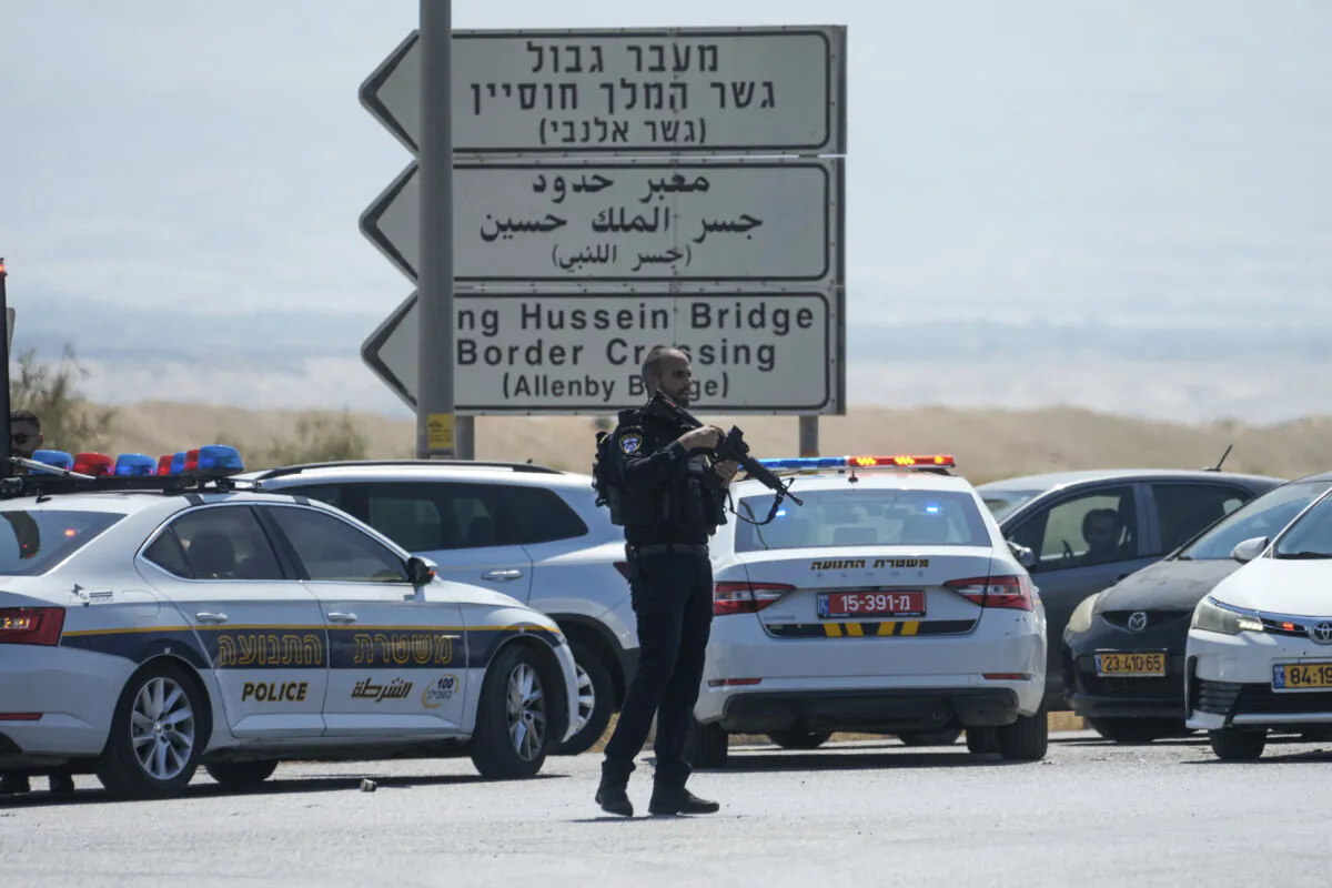 Israeli police stand guard near the site of a deadly shooting attack where Israeli officials say three people were shot and killed at the Allenby Bridge Crossing between the West Bank and Jordan, on Sept. 8, 2024. (Mahmoud Illean/AP Photo)