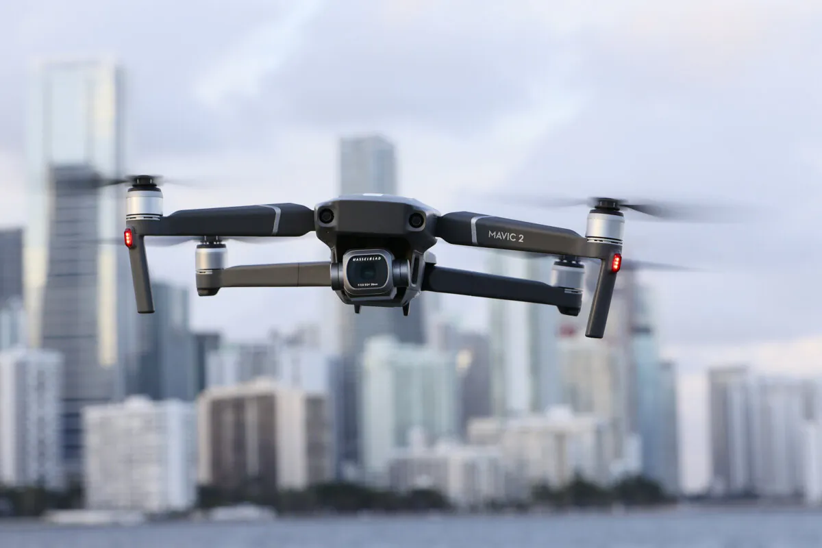In this photo illustration, a DJI Mavic 2 Pro made by the Chinese drone maker hovers in place in Miami on Dec. 15, 2021. (Joe Raedle/Getty Images)