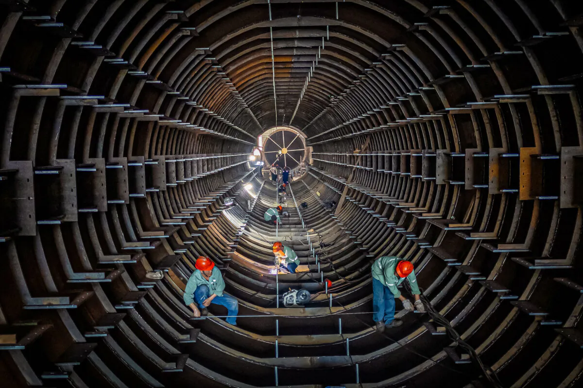 Employees work on a steel tube tower production line at a factory in Haian, Jiangsu Province, China, on Sept. 1, 2024. (STR/AFP via Getty Images)
