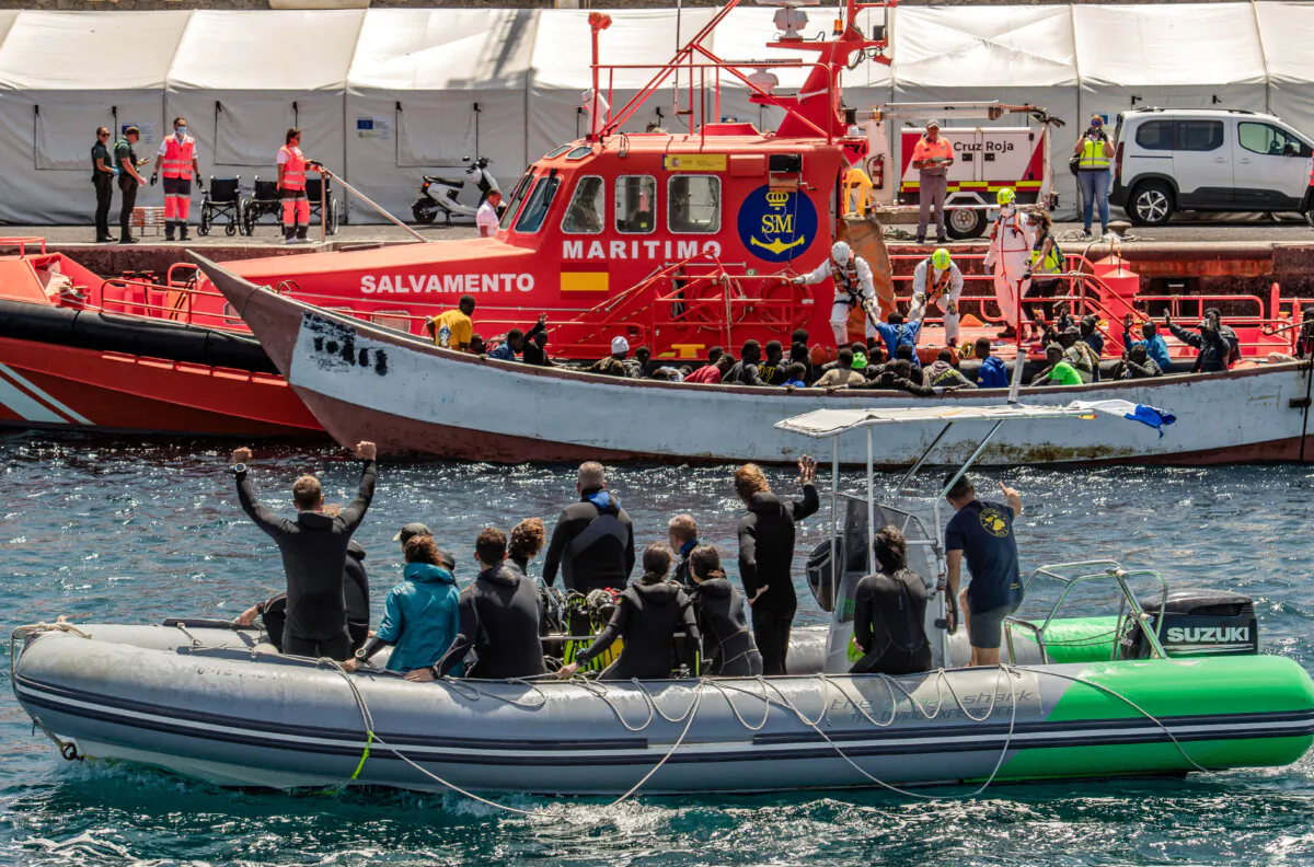 A dinghy boat drives past a Spanish Salvamento Maritimo (Sea Search and Rescue agency) vessel on the Canary island of El Hierro, on Sept. 9, 2024. (Antonio Sempere/AFP via Getty Images)