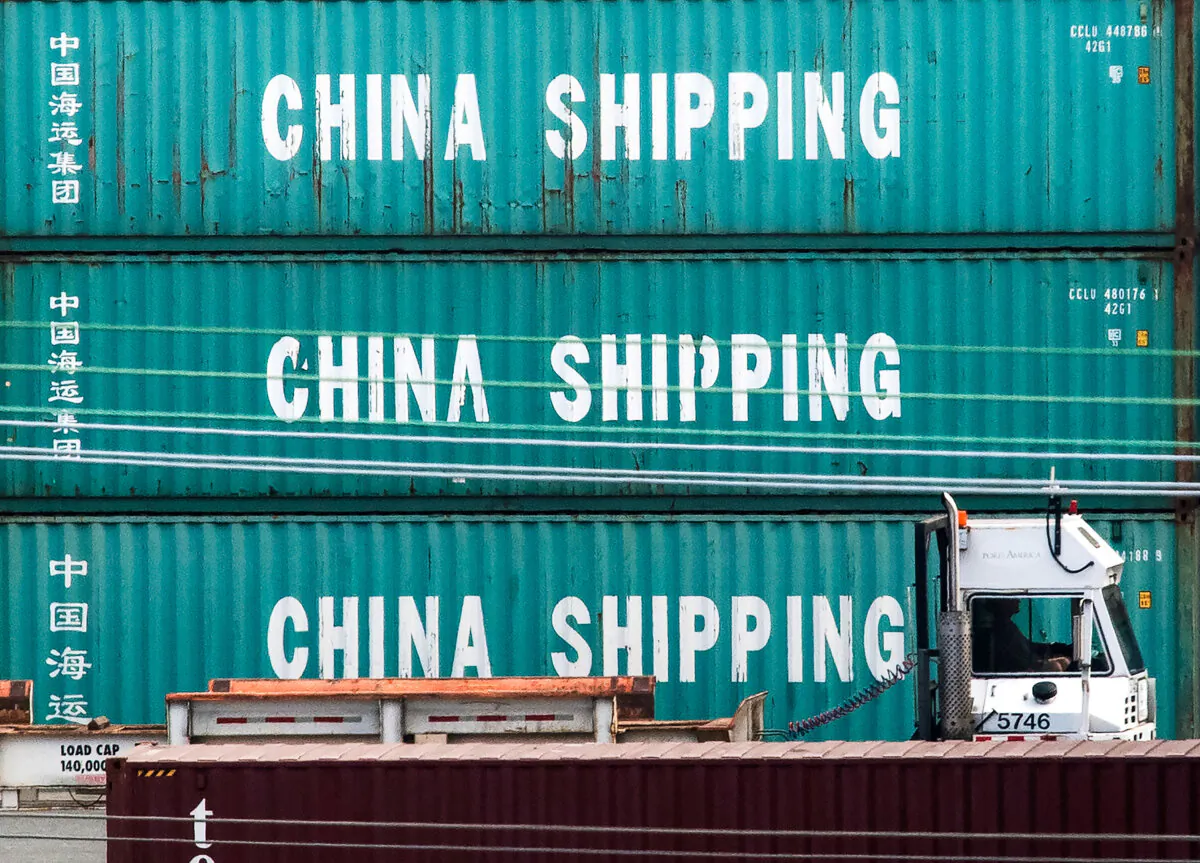 A truck passes by China dhipping containers at the Port of Los Angeles, in Long Beach, Calif. on Sept. 1, 2019. (Mark Ralston/AFP via Getty Images)