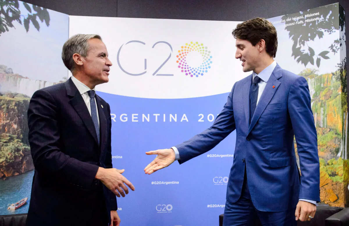 Prime Minister Justin Trudeau meets with then-Bank of England governor Mark Carney at the G20 Summit in Buenos Aires, Argentina, on Nov. 30, 2018. (The Canadian Press/Sean Kilpatrick)