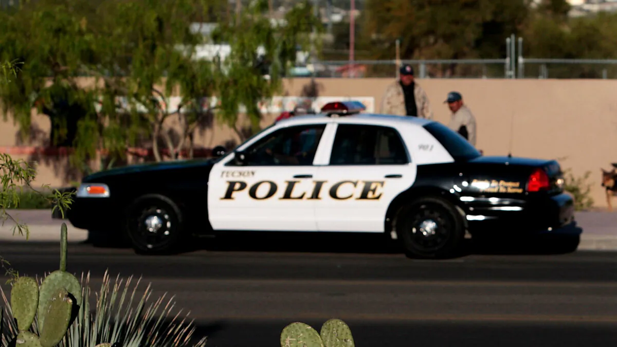 A police car is parked on a street in Tucson, Ariz., on April 5, 2008. (Chris Hondros/Getty Images)