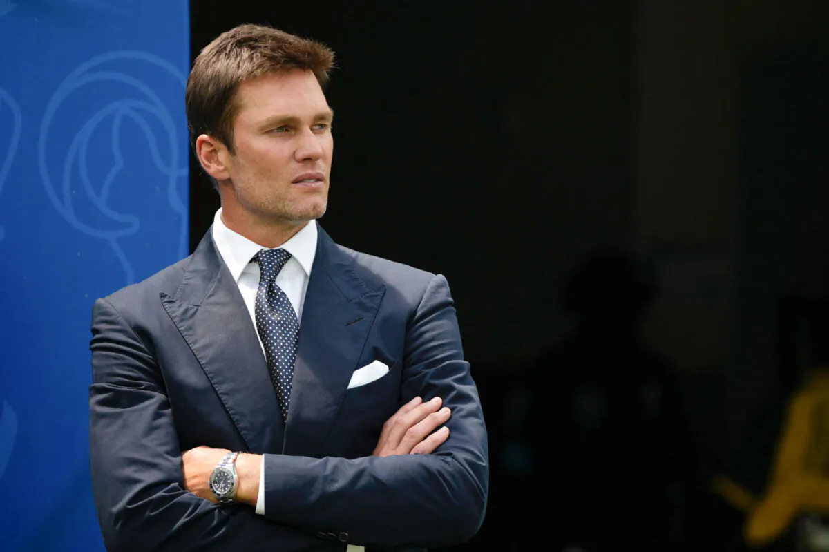 Tom Brady watches warmups before a preseason NFL football game between the Dallas Cowboys and Los Angeles Rams in Inglewood, Calif., on Aug. 11, 2024. (Gregory Bull/AP Photo)