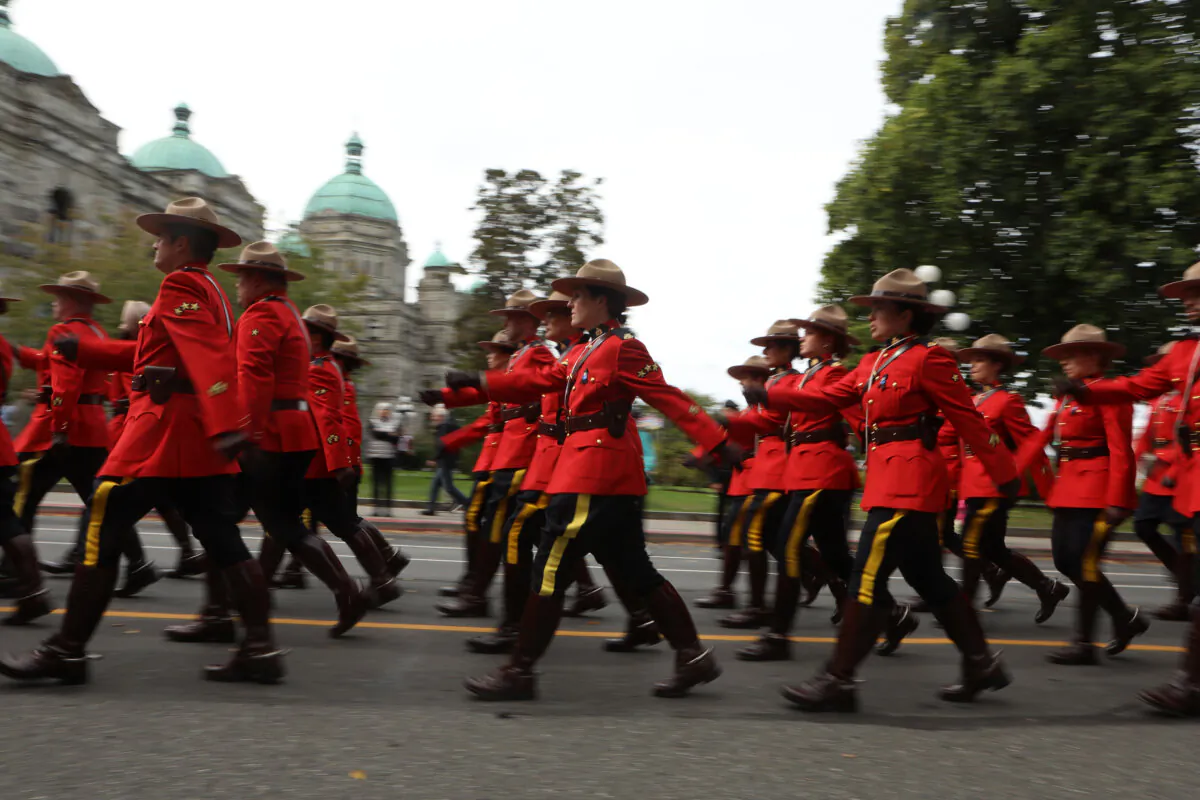 RCMP officers march towards the B.C. Law Enforcement Memorial ceremony at the legislature in Victoria, B.C., on Sept. 24, 2023. (The Canadian Press/Chad Hipolito)
