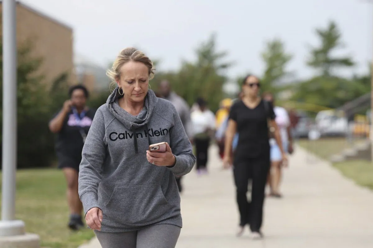 Family members of students at Northwest high school gather and wait for students to be released from the school after a shooting was reported, in Omaha, Neb., on Sept. 10, 2024. (Megan Nielsen/Omaha World-Herald via AP)
