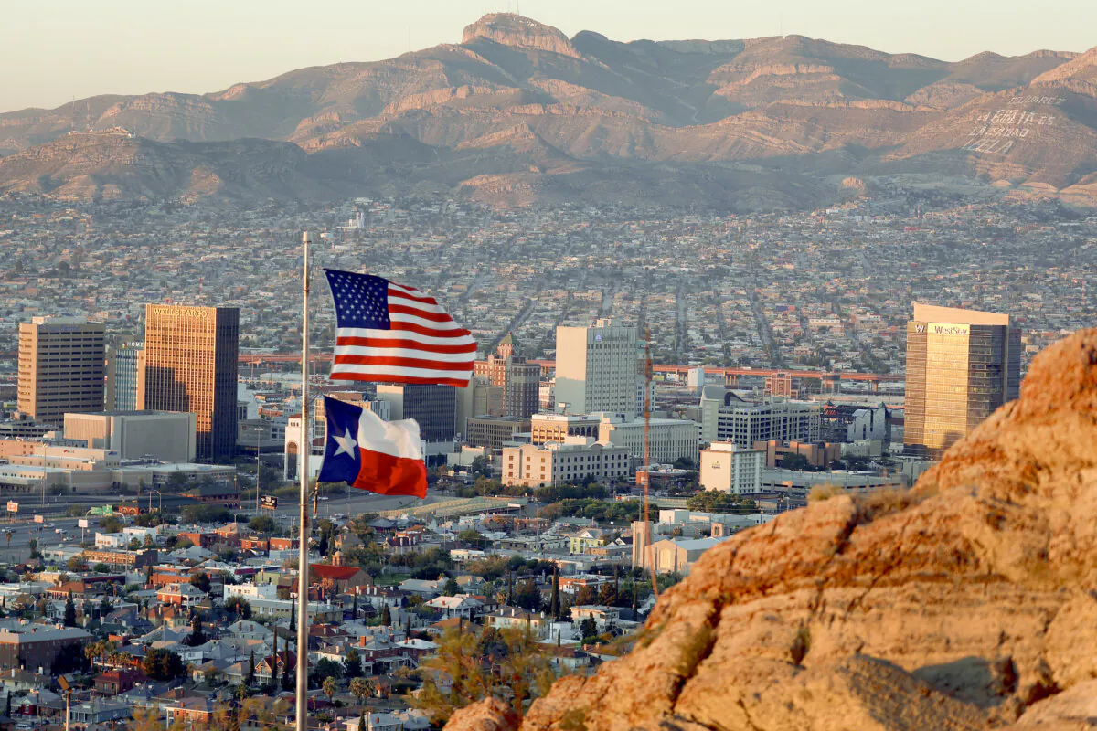 An American and Texas flag fly in front of the skyline of El Paso and Ciudad Juarez in El Paso, Texas, on Sept. 23, 2022. (Joe Raedle/Getty Images)