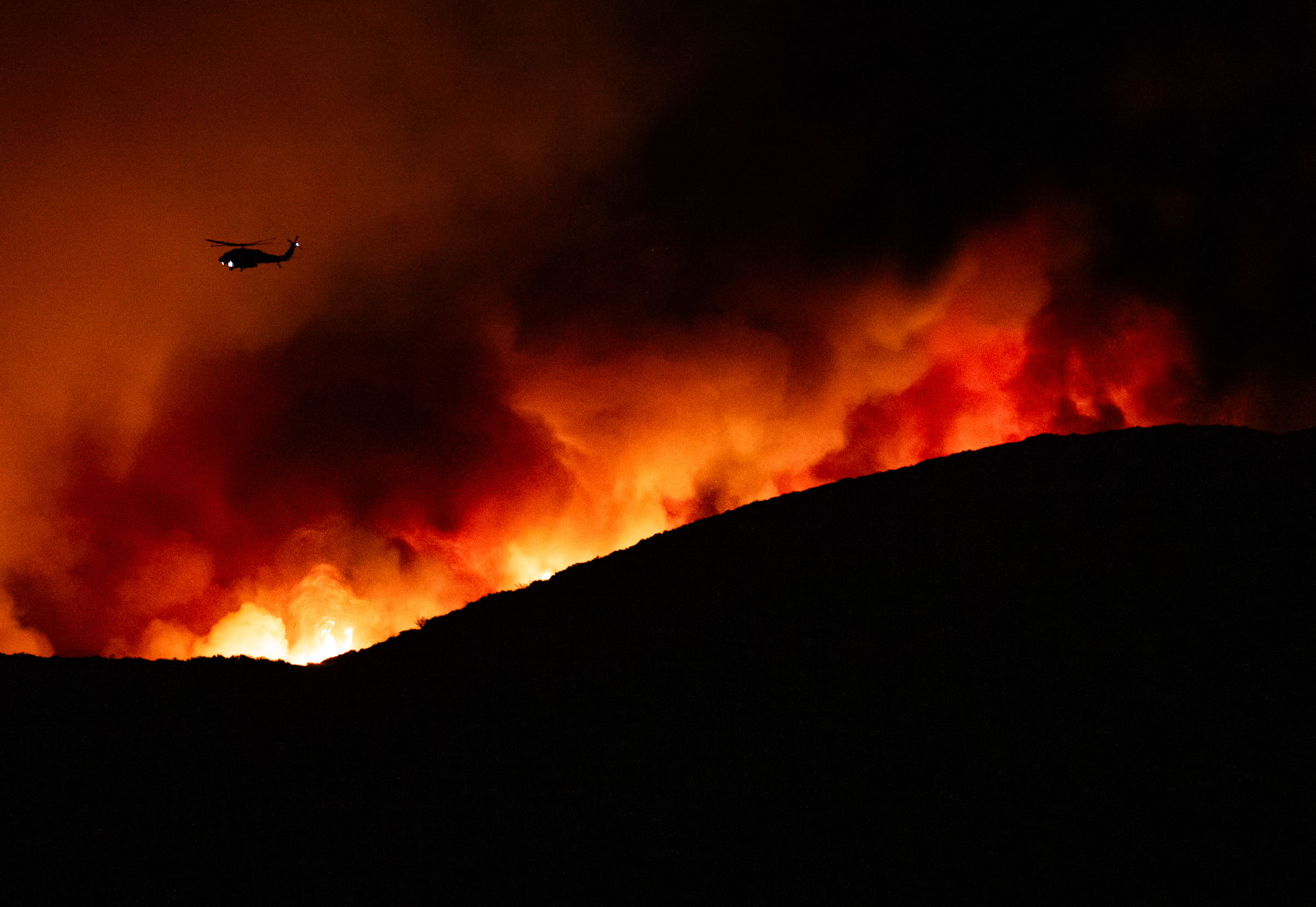 Day in Photos: California Fire, Remembering the Fallen, and Polaris Dawn Mission Begins