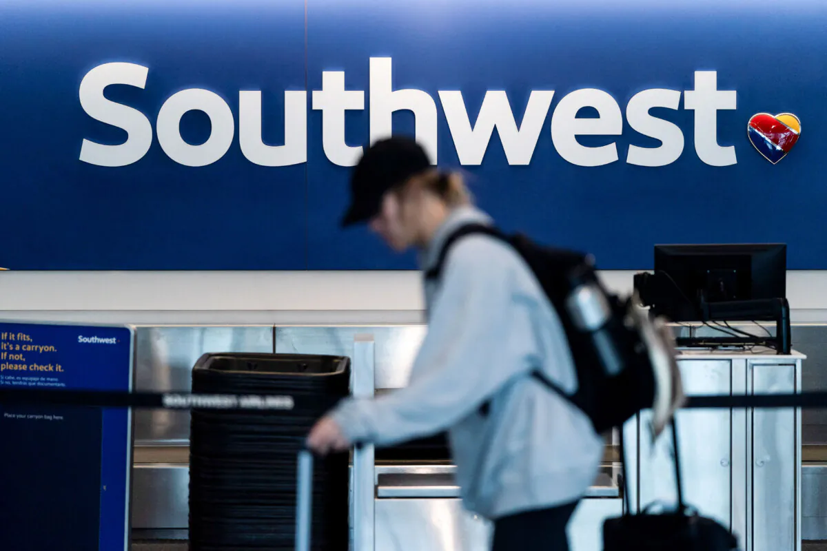 A traveler walks through the Southwest Airlines ticketing counter area at the Los Angeles International Airport in Los Angeles on April 18, 2023. (Jae C. Hong/AP Photo)