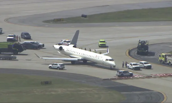 Two Delta Planes Collide on an Atlanta Taxiway, Knocking the Tail Off One