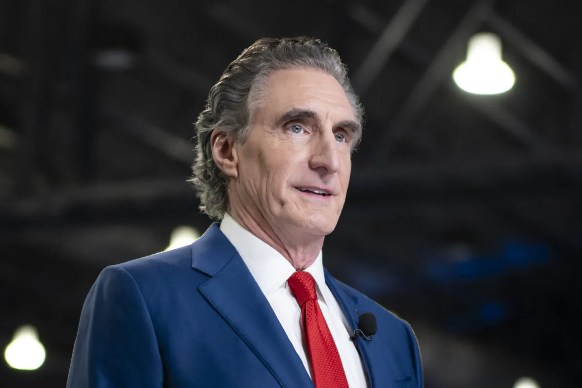 North Dakota Gov. Doug Burgum prepares for a TV interview at the media filing center and spin room at the Pennsylvania Convention Center ahead of the presidential debate between Republican nominee former President Donald J. Trump and Democratic nominee Vice President Kamala Harris in Philadelphia, Pa., on Sept. 10, 2024. (Madalina Vasiliu/The Epoch Times)
