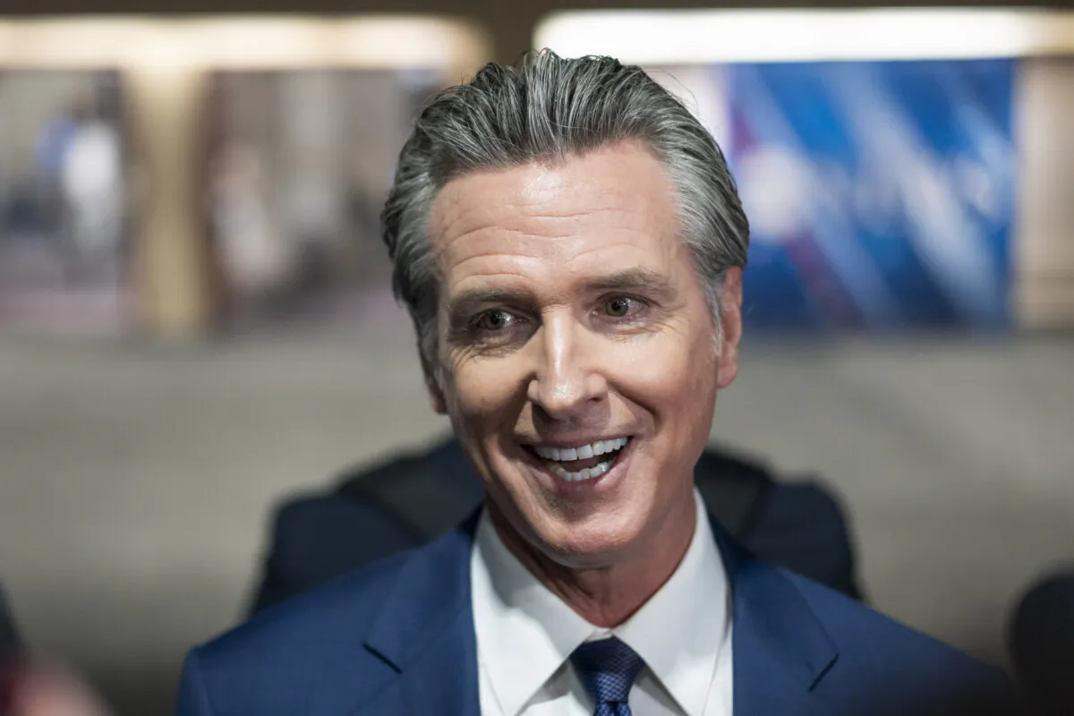 California Gov. Gavin Newsom speaks to reporters at the media filing center and spin room at the Pennsylvania Convention Center ahead of the presidential debate between Republican nominee former President Donald J. Trump and Democratic nominee Vice President Kamala Harris in Philadelphia, Pa., on Sept. 10, 2024. (Madalina Vasiliu/The Epoch Times) 