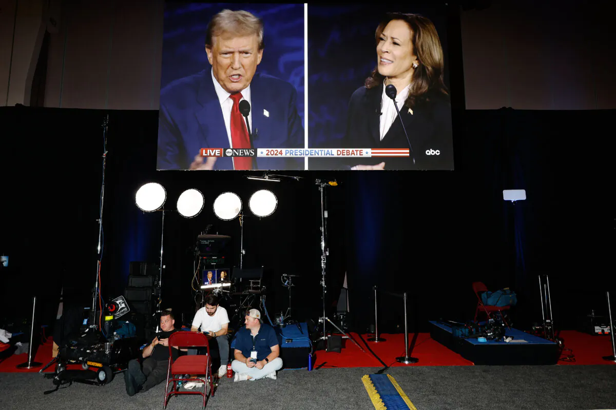 Republican presidential nominee, former President Donald Trump and Democratic presidential nominee, Vice President Kamala Harris are seen on screens in the media center at the Pennsylvania Convention Center on Sept. 10, 2024. (Chip Somodevilla/Getty Images)