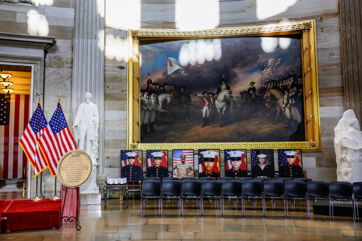 Photos of the 13 American service members who died in the suicide bombing at Hamid Karzai International Airport in Afghanistan sit on display ahead of a medal-awarding ceremony, in the U.S. Capitol rotunda on Sept. 10, 2024. (Anna Moneymaker/Getty Images)