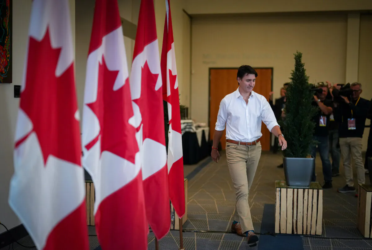 Prime Minister Justin Trudeau arrives to speak to reporters at the Liberal caucus retreat in Nanaimo, B.C., on Sept. 11, 2024. (Darryl Dyck/The Canadian Press)