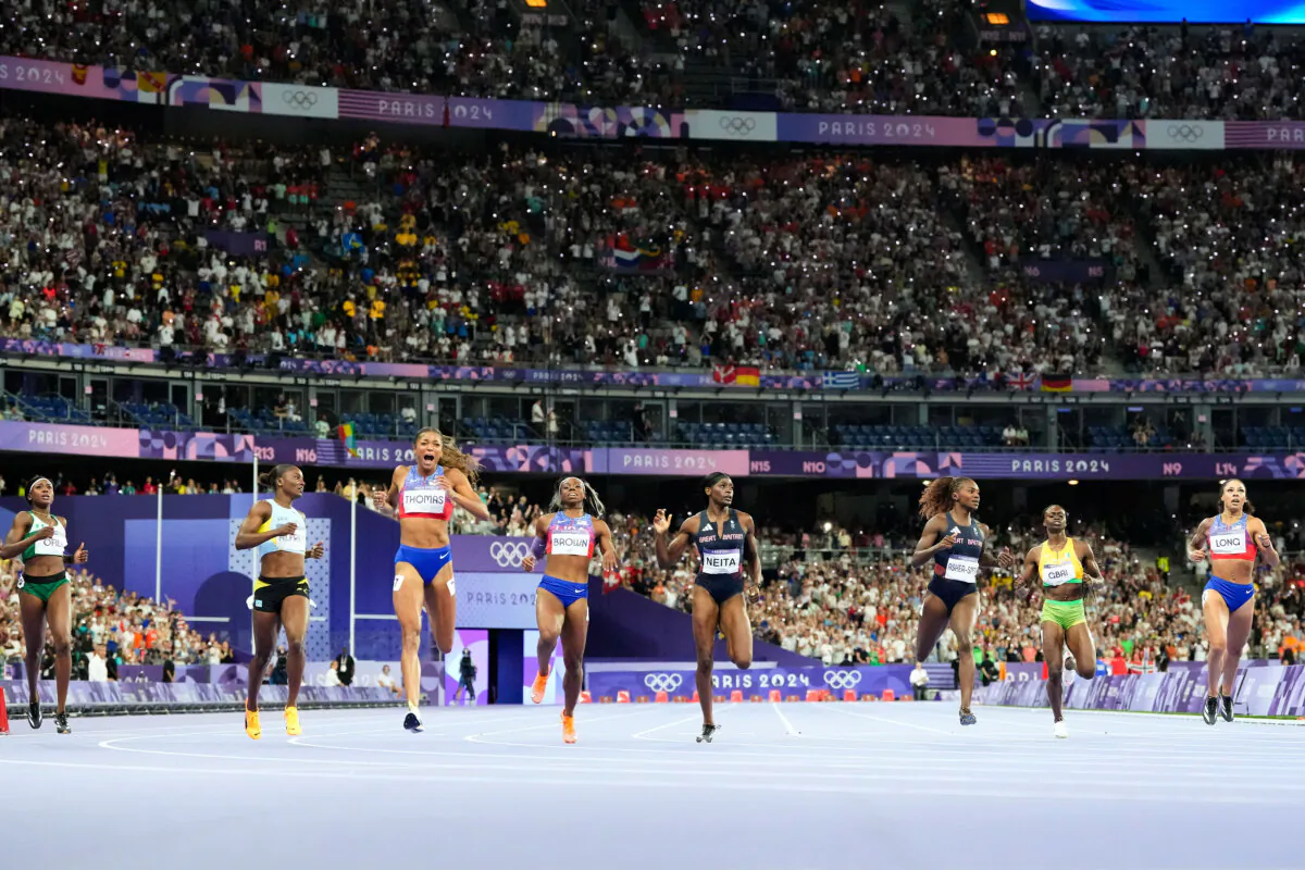 Gabrielle Thomas (3rd L) of the United States reacts after winning the women's 200-meter final at the 2024 Summer Olympics in Saint-Denis, France, on Aug. 6, 2024. (Petr David Josek /AP Photo)