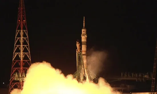 Soyuz Craft With 2 Russians and 1 American Docks at International Space Station