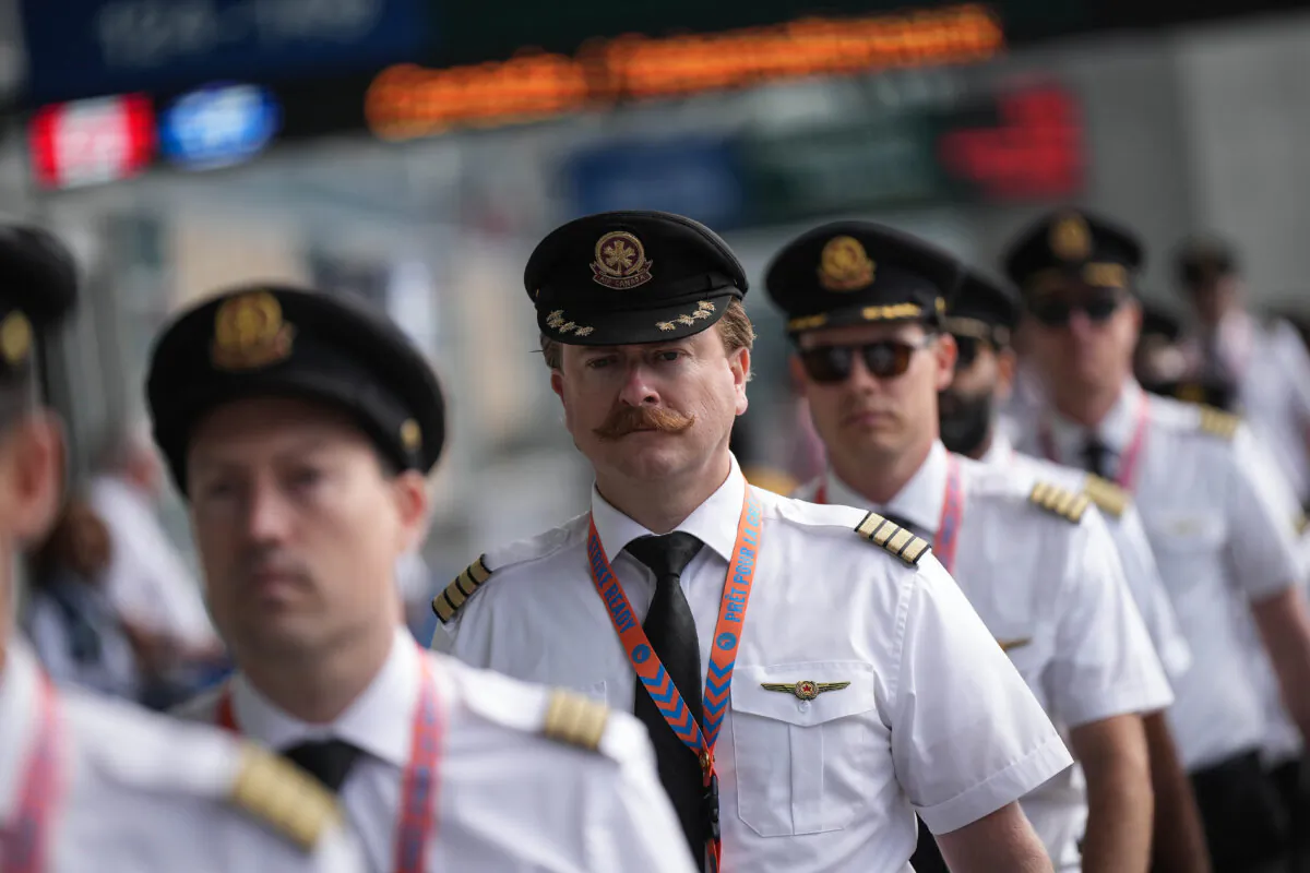 Air Canada pilots arrive for an information picket at Vancouver International Airport in Richmond, B.C., on Aug. 27, 2024. (The Canadian Press/Darryl Dyck)
