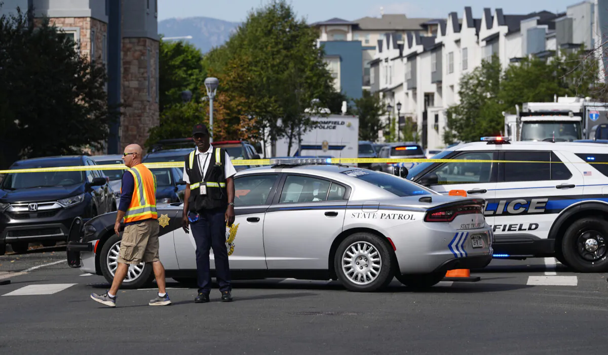 Law enforcement officials at the scene of a shooting in an apartment complex in Broomfield, Colo., on Sept. 12, 2024. (David Zalubowski/AP Photo)