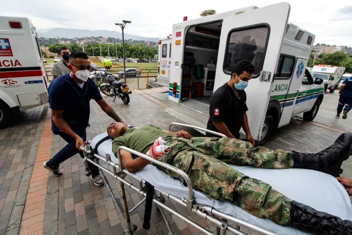 Medical workers bring an injured soldier on a stretcher in a hospital following a explosion in Cucuta, Colombia, on June 15, 2021. (Schneyder Mendoza / AFP via Getty Images)