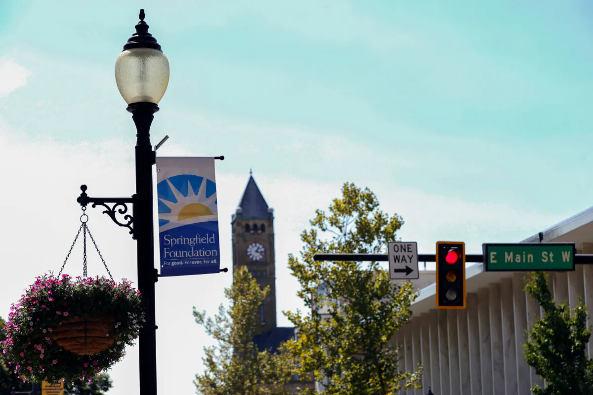 A sign hangs from a streetlight at the intersection of Main Street and Fountain Avenue in Springfield, Ohio, on Sept. 11, 2024. (Paul Vernon/AP Photo)