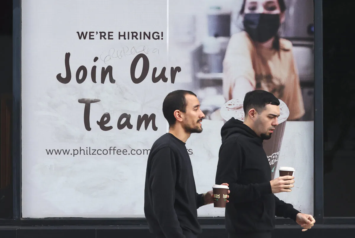 A hiring sign is posted outside a coffee shop in Los Angeles on Jan. 3, 2024. (Mario Tama/Getty Images)