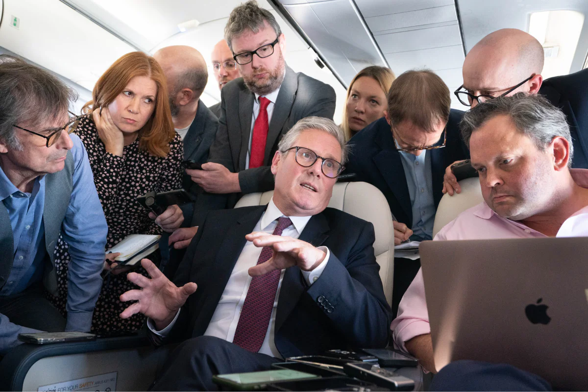 Prime Minister Sir Keir Starmer talks to the media on board his plane as he flies to Washington on Sept. 12, 2024. (Stefan Rousseau/PA Wire)