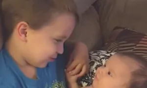 Older Brother Sings to Baby Sister