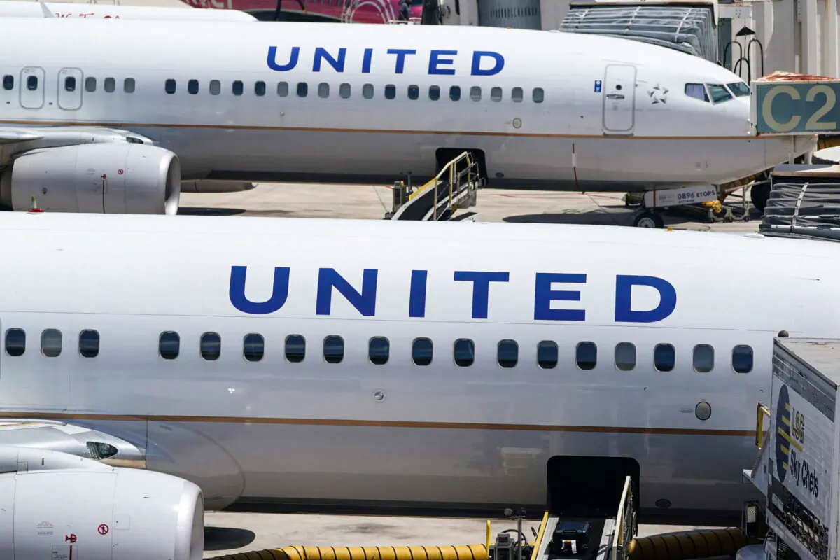Two United Airlines Boeing 737s are parked at the gate at the Fort Lauderdale-Hollywood International Airport in Fort Lauderdale, Fla., on July 7, 2022. (Wilfredo Lee/AP Photo)