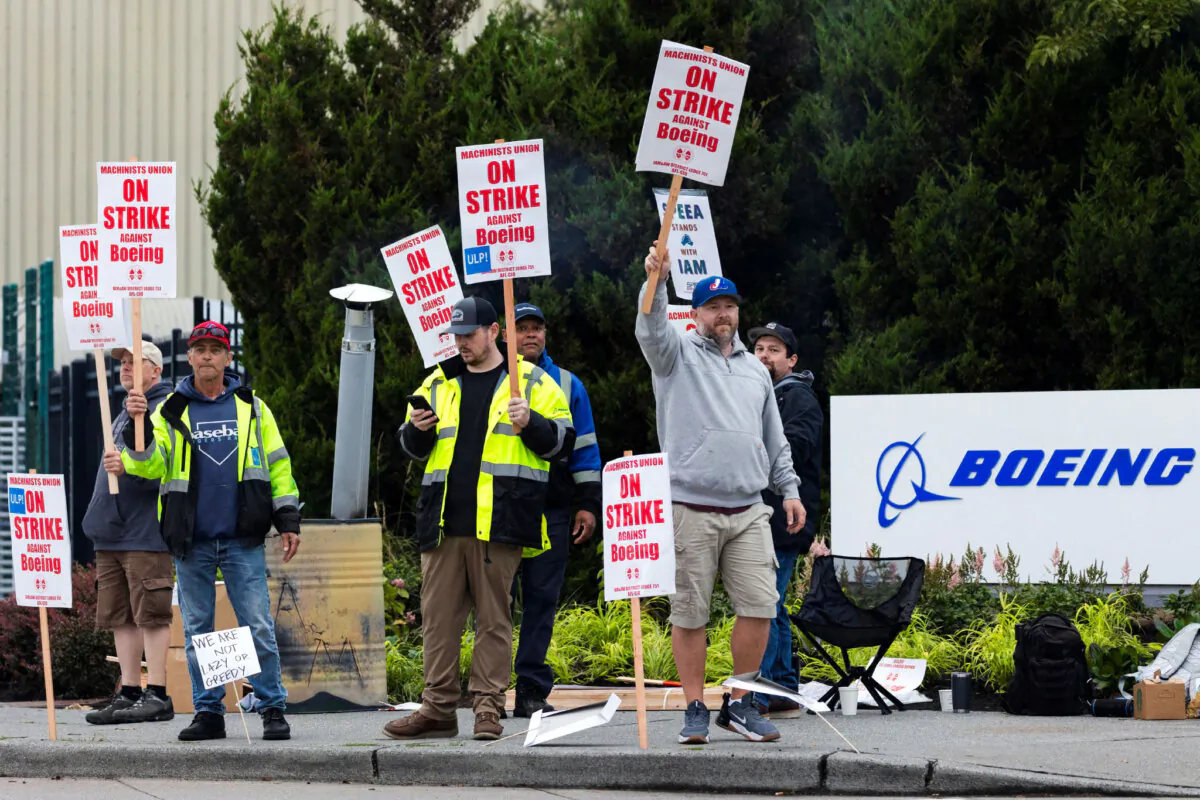 Boeing factory workers gather on a picket line during the first day of a strike near the entrance of a production facility in Renton, Washington, U.S., September 13, 2024. REUTERS/Matt Mills McKnight