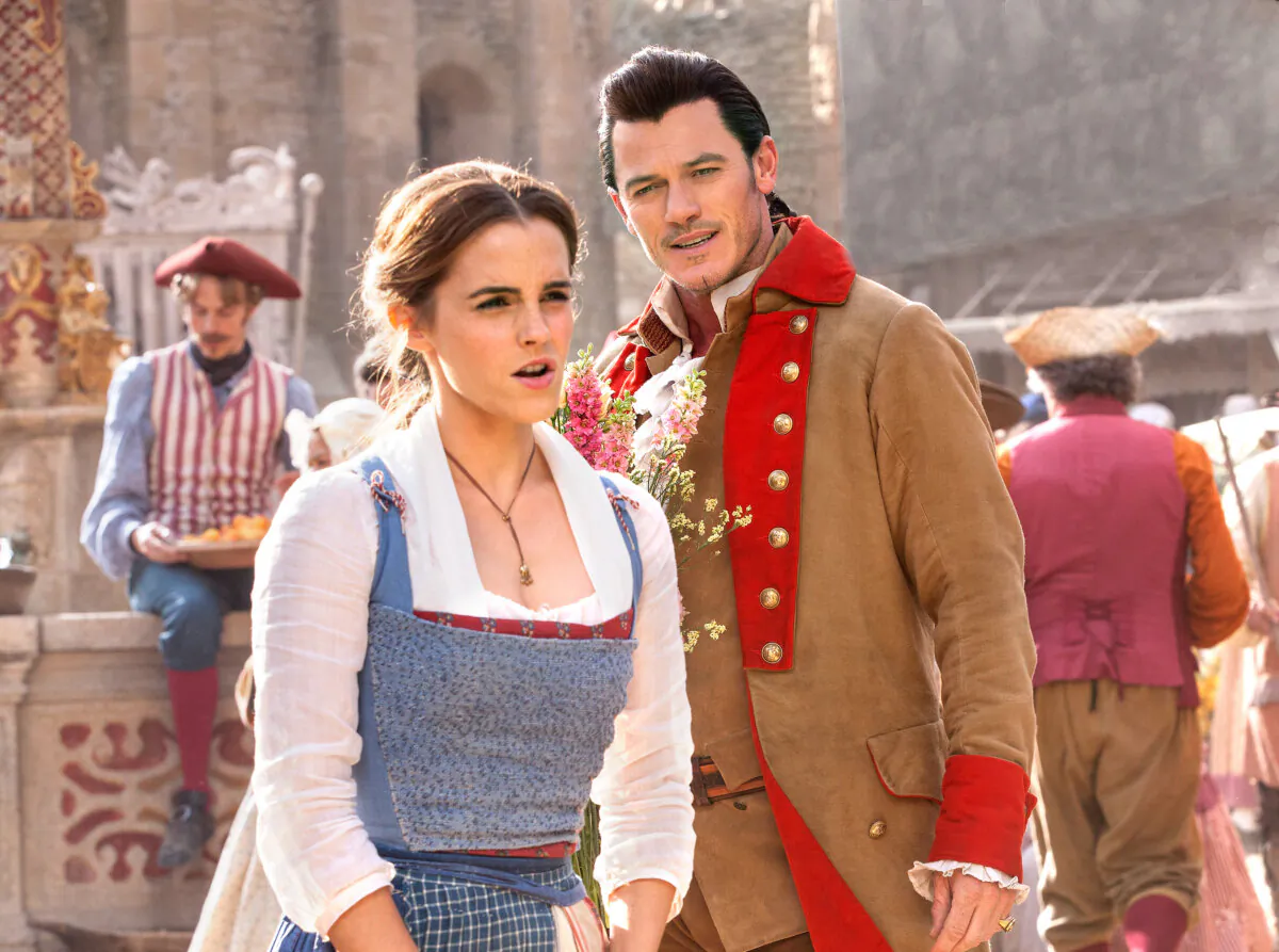 Beauty (Emma Watson) is courted by Gaston (Luke Evans), in "Beauty and the Beast." Nonsinging actors often take on musical roles. (MovieStillsDB)