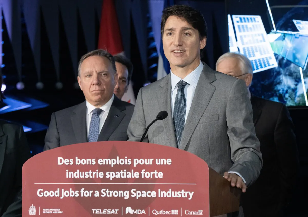 Prime Minister Justin Trudeau and Quebec Premier François Legault (L) at the MDA satellite manufacturing centre in Ste.Anne-de-Bellevue, Quebec, on Sept. 13, 2024. (The Canadian Press/Ryan Remiorz)