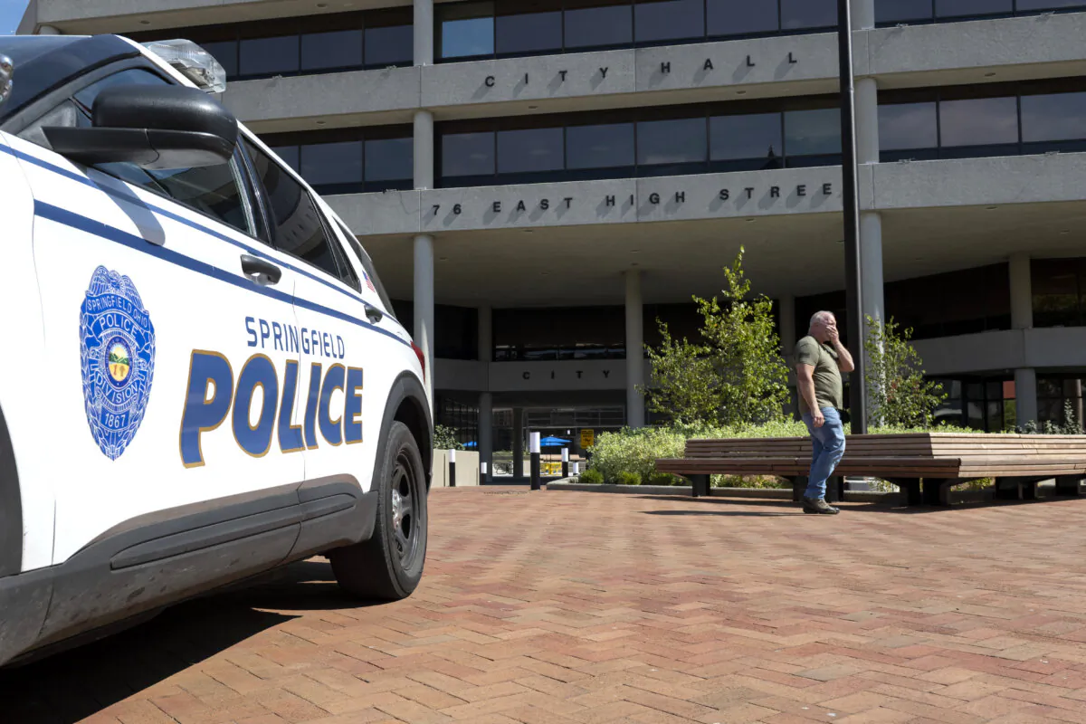A man walks past the Springfield City Hall after bomb threats were made against buildings earlier in the day in Springfield, Ohio, on Sept. 12, 2024. (Roberto Schmidt/AFP via Getty Images)