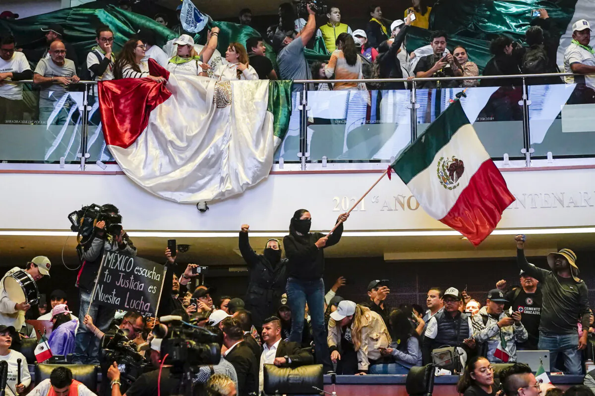 Protesters interrupt a session in which lawmakers were debating the government's proposed judicial reform, in the Senate in Mexico City on Sept. 10, 2024. (Felix Marquez/AP Photo)