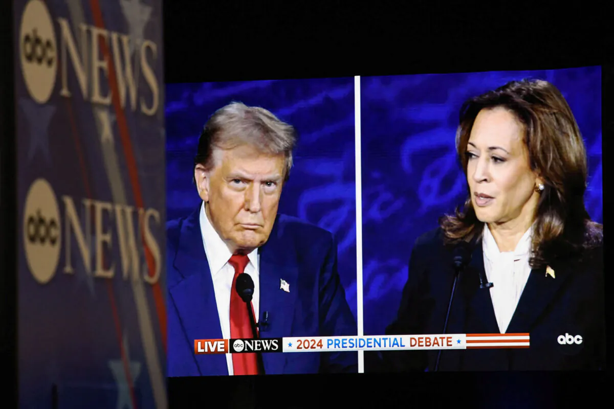 Vice President and Democratic presidential nominee Kamala Harris and former U.S. President and Republican presidential nominee Donald Trump on a screen in the spin room as they participate in a presidential debate at the National Constitution Center in Philadelphia on Sept. 10, 2024. (Matthew Hatcher/AFP via Getty Images)