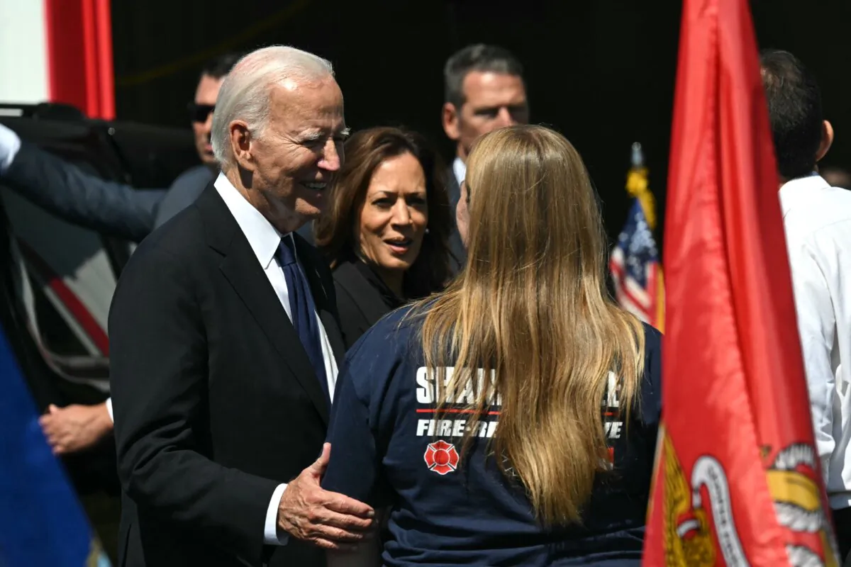 President Joe Biden (L) and Vice President Kamala Harris meet with volunteer firefighters as they visit the Shanksville Volunteer Fire Department on the 23rd anniversary of the Sept. 11 terror attack in Shanksville, Pa., on Sept. 11, 2024. (Andrew Caballero-Reynolds/AFP via Getty Images)