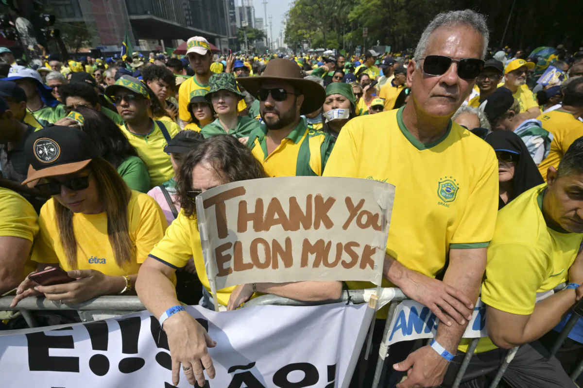 Supporters of former Brazilian President Jair Bolsonaro hold a sign thanking X social media platform owner Elon Musk, during an Independence day rally in Sao Paulo, Brazil on Sept. 7, 2024. (NELSON ALMEIDA/AFP via Getty Images)