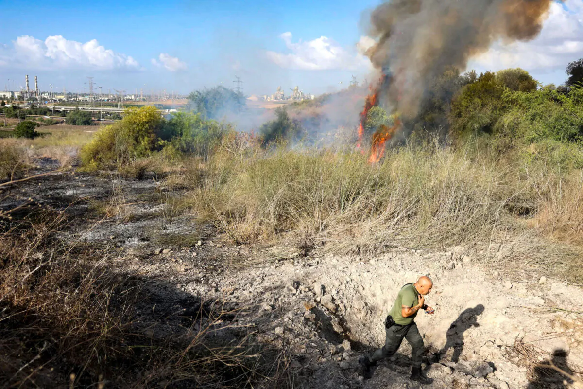 Smoke billows after a missile attack from Yemen in central Israel on Sept. 15, 2024. (Ronen Zvulun/Reuters)