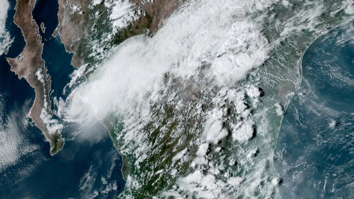 Tropical Storm Ileana (L) near the coastal Mexican city of Topolobampo on the eastern side of the Gulf of California at 6:10 p.m. ET on Sept. 14, 2024. (NOAA via AP)