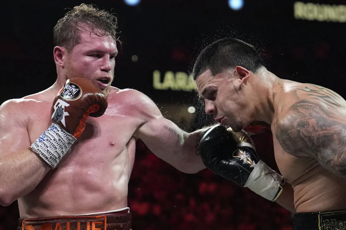 Canelo Alvarez hits Edgar Berlanga in a super middleweight title bout,  in Las Vegas, on Sept. 14, 2024. (John Locher/AP Photo)