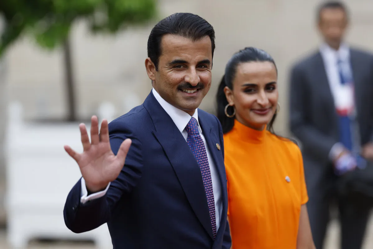 Emir of Qatar Sheikh Tamim bin Hamad bin Khalifa Al Thani and Sheikha Hind bint Hamad bin Khalifa al-Thani arrive at the Elysee Palace ahead of an opening ceremony at the 2024 Summer Olympics, in Paris, France, on July 26, 2024. (The Canadian Press/AP-Aurelien Morissard)