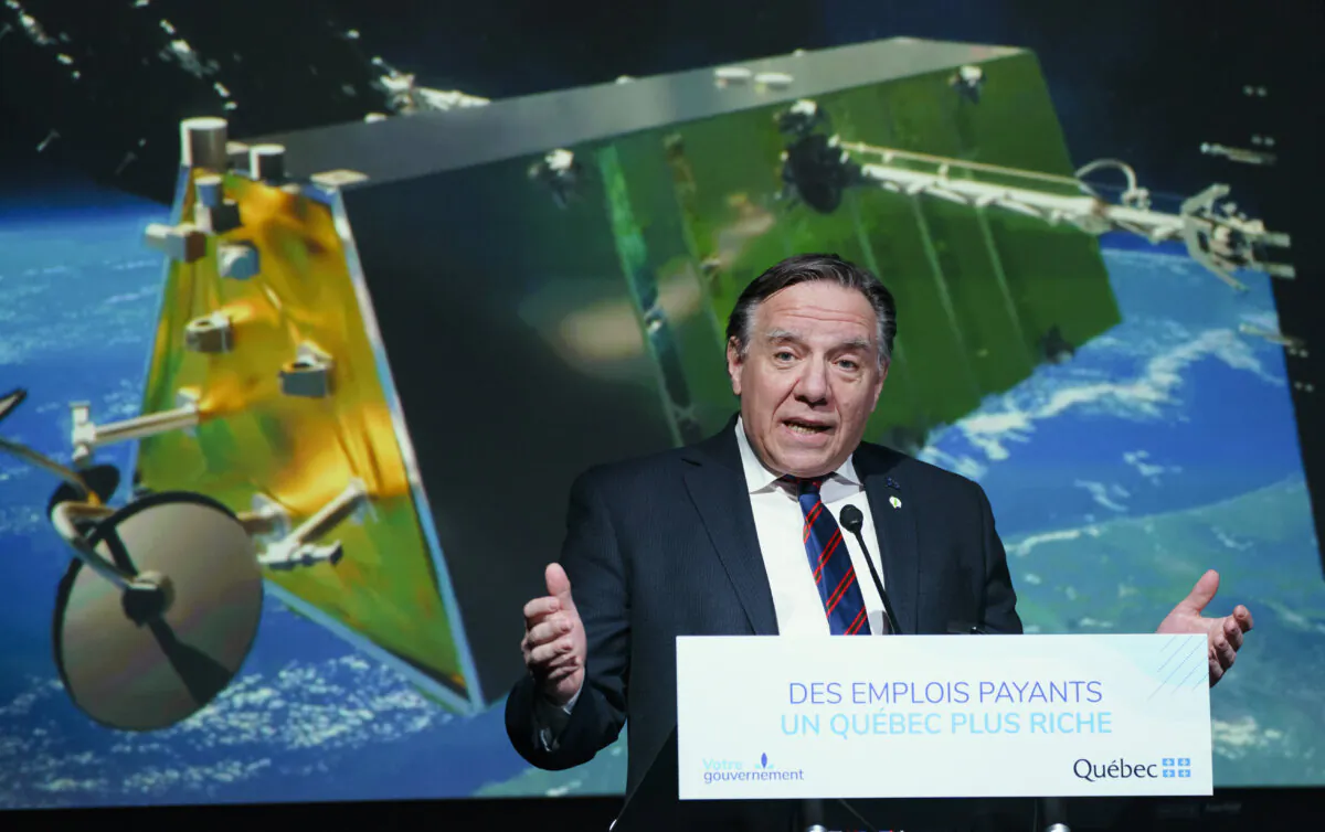 Quebec Premier François Legault announces a tentative agreement with Telesat LEO Inc. and MacDonald, Dettwiler and Associates Ltd. (MDA) to invest in the Telesat Lightspeed network aerospace project, in Montreal on Feb. 18, 2021. (The Canadian Press/Paul Chiasson)