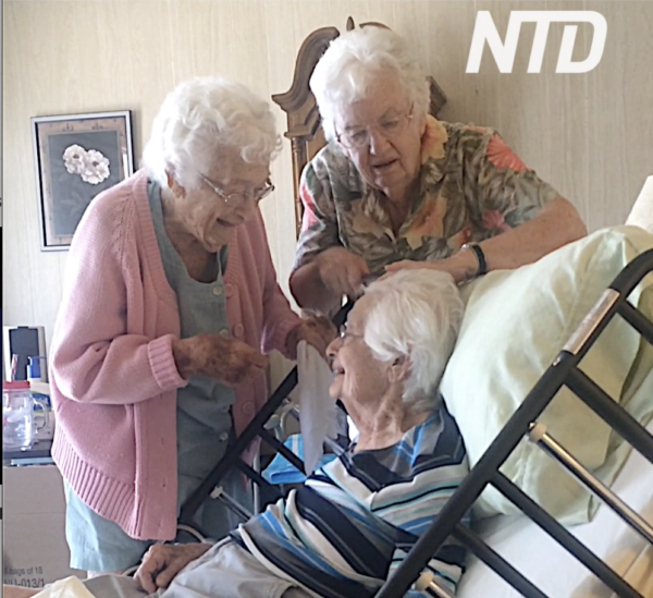 Grandmother Gets Hair Brushed by Sisters