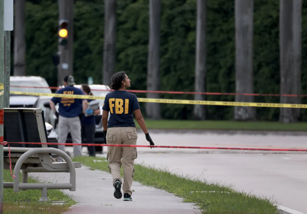 Law enforcement personnel investigate the area around Trump International Golf Club after an apparent assassination attempt of former President Donald Trump in West Palm Beach, Florida on Sept. 15, 2024. (Joe Raedle/Getty Images)
