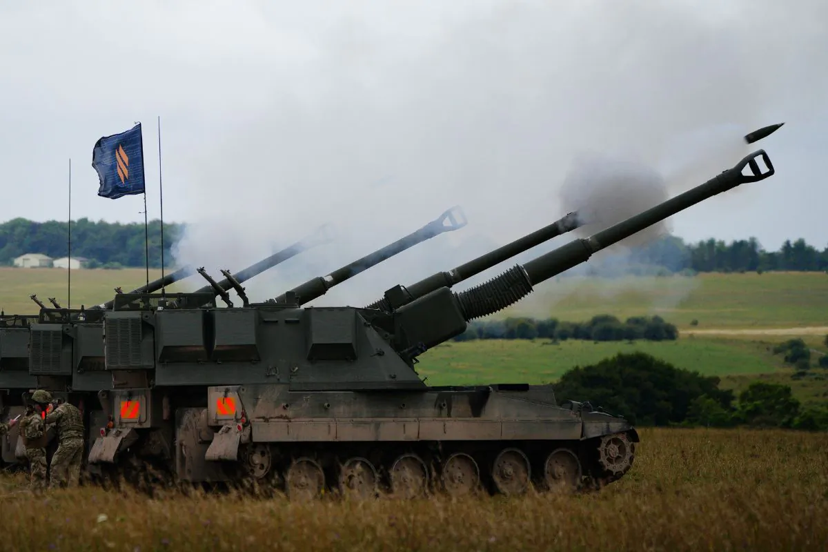Newly trained Ukrainian artillery specialists firing British donated AS90 155mm self-propelled artillery guns under the supervision of British Army instructors as they come to the end of their training in south west England on July 27, 2023. (Ben Birchall/PA Wire)