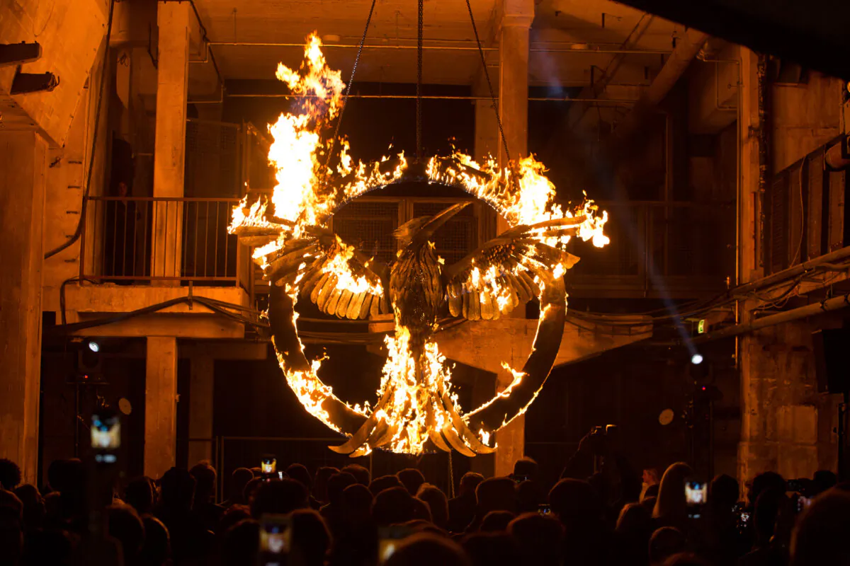 The burning symbol of the movie is pictured during a preview event for “The Hunger Games: Mockingjay-Part 1” at Kraftwerk Mitte in Berlin on Nov. 11, 2014. (Christian Marquardt/Getty Images)